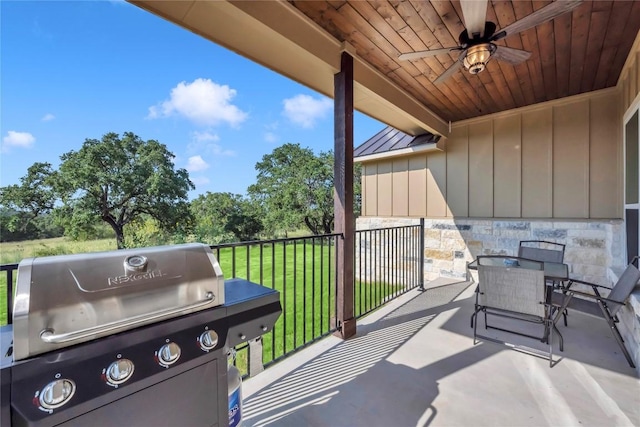 view of patio / terrace featuring a ceiling fan, outdoor dining space, and grilling area