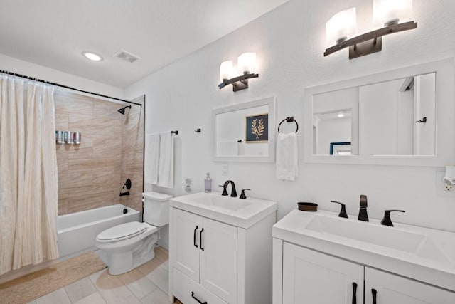 bathroom with two vanities, a sink, visible vents, and shower / bath combo with shower curtain