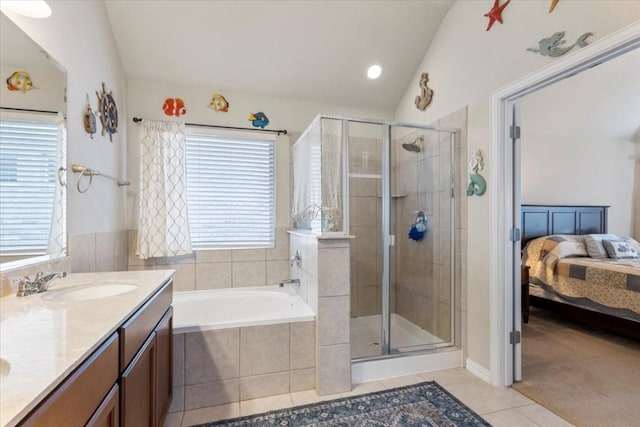 221 Joseph Dr, Buda, TX 78610 - ensuite bathroom with a sink, tile patterned flooring, a stall shower, and lofted ceiling