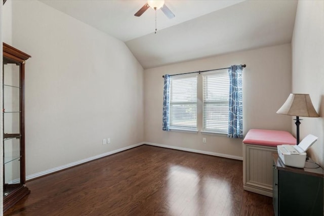221 Joseph Dr, Buda, TX 78610 - unfurnished bedroom with dark wood-style flooring, baseboards, vaulted ceiling, and a ceiling fan