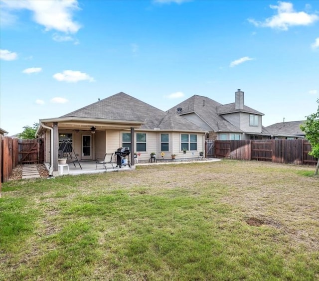 221 Joseph Dr, Buda, TX 78610 - rear view of house featuring a lawn, a patio, a ceiling fan, and a fenced backyard