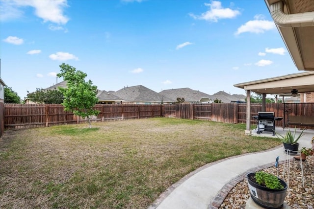 221 Joseph Dr, Buda, TX 78610 - view of yard featuring a fenced backyard, a ceiling fan, and a patio