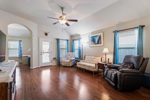 221 Joseph Dr, Buda, TX 78610 - living area with arched walkways, a ceiling fan, lofted ceiling, and dark wood-type flooring
