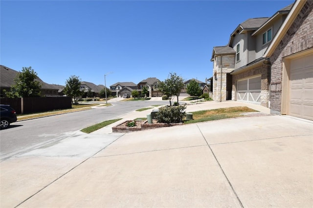 221 Joseph Dr, Buda, TX 78610 - view of street with street lighting, sidewalks, and a residential view