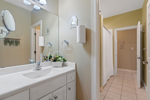 full bathroom featuring vanity and tile patterned floors