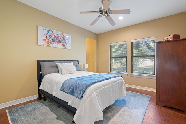 bedroom with ceiling fan, baseboards, dark wood-style flooring, and recessed lighting