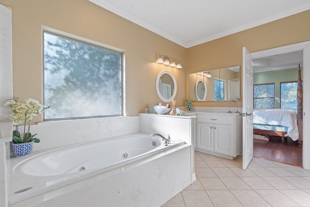 full bath with tile patterned flooring, vanity, ornamental molding, a tub with jets, and ensuite bath