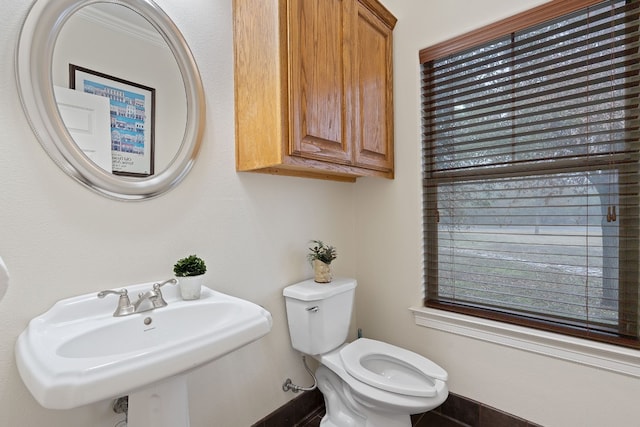 bathroom featuring toilet and a sink