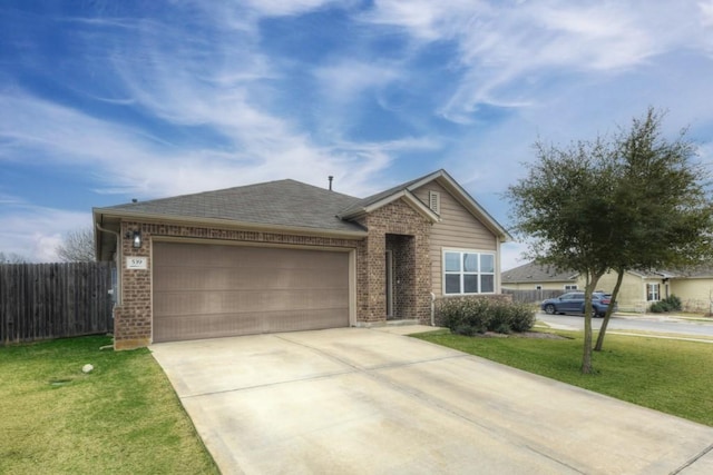 single story home featuring brick siding, concrete driveway, an attached garage, a front yard, and fence