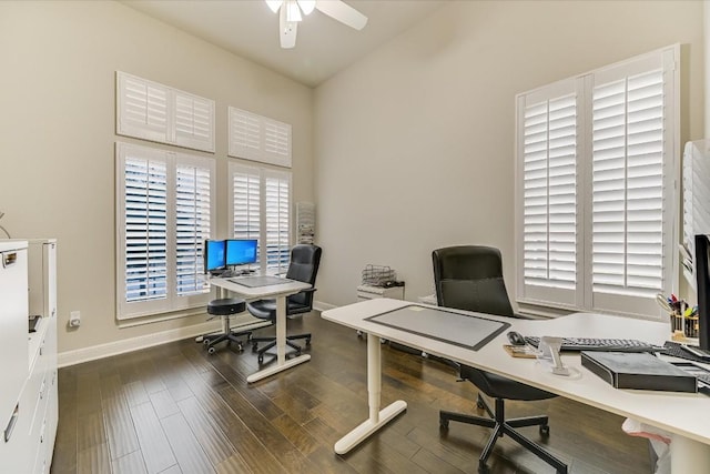 home office featuring ceiling fan, baseboards, and dark wood-type flooring