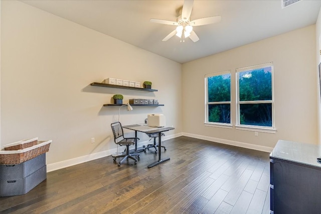 office space featuring ceiling fan, baseboards, and dark wood finished floors