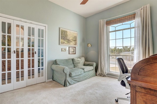 carpeted office featuring french doors, a healthy amount of sunlight, and ceiling fan