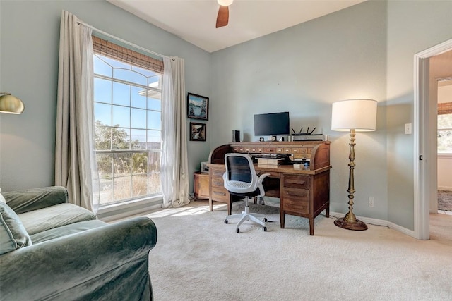 office area with carpet floors, ceiling fan, and baseboards