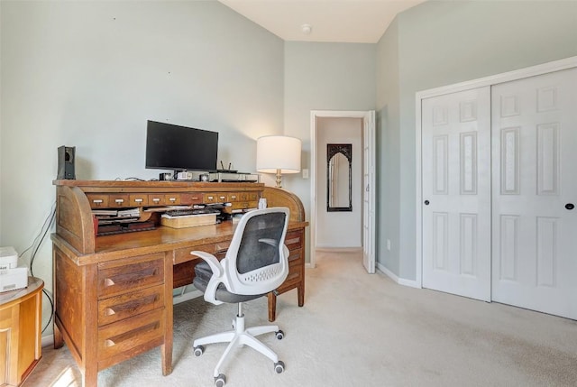 office space with light carpet and baseboards