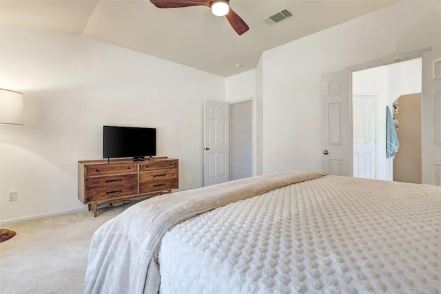 bedroom with light carpet, baseboards, visible vents, a ceiling fan, and vaulted ceiling