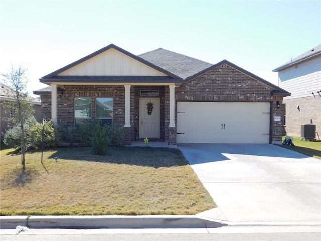 view of front of property with a garage, central AC unit, concrete driveway, board and batten siding, and brick siding