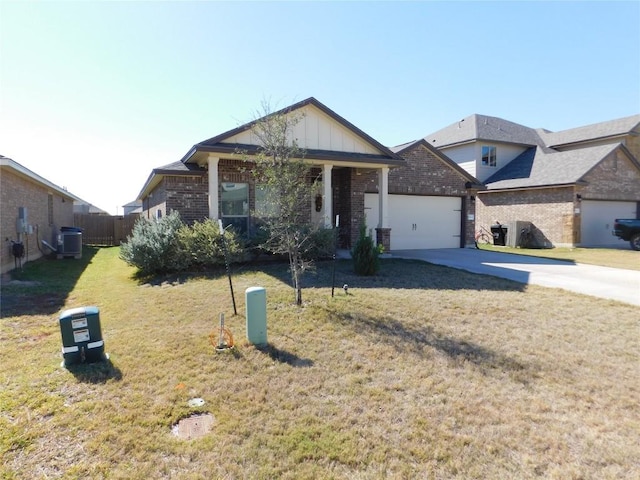 view of front of house featuring an attached garage, brick siding, concrete driveway, board and batten siding, and a front yard