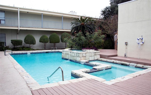 view of pool featuring a pool with connected hot tub