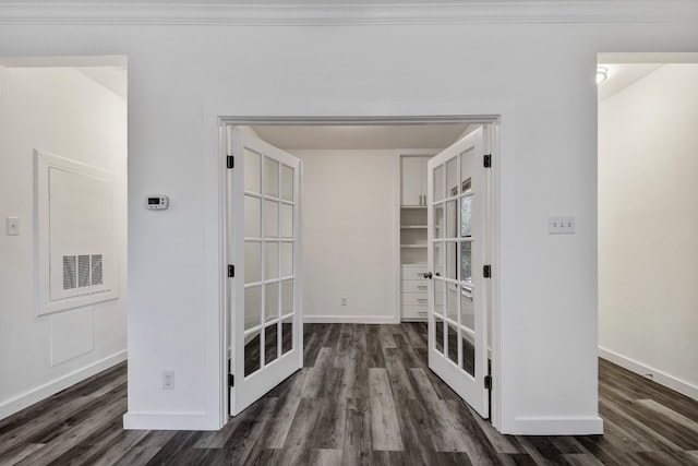 corridor with baseboards and dark wood finished floors