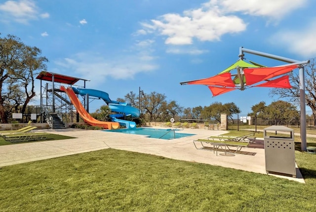 view of jungle gym featuring a lawn and a community pool