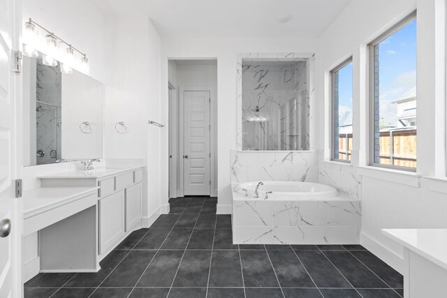 100 Wild Bluebell Cv, Georgetown, TX 78628 - bathroom featuring vanity, a bath, a marble finish shower, and tile patterned floors