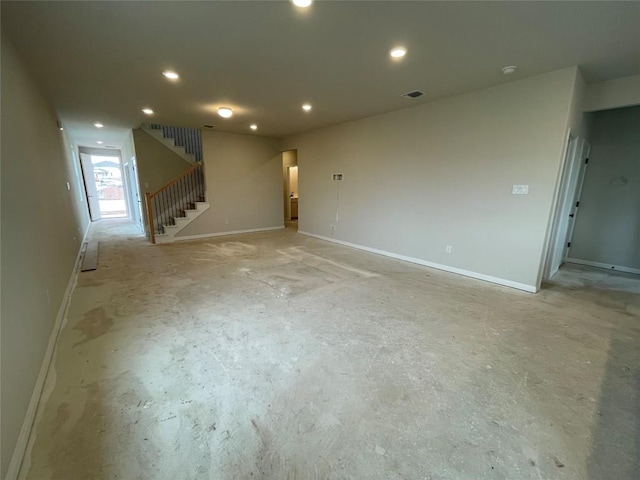 interior space featuring recessed lighting, visible vents, unfinished concrete flooring, and stairway