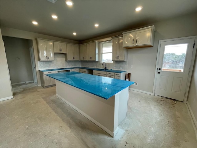 kitchen featuring a center island, recessed lighting, decorative backsplash, unfinished concrete floors, and baseboards