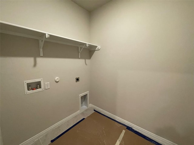 laundry room with gas dryer hookup, hookup for an electric dryer, laundry area, washer hookup, and baseboards