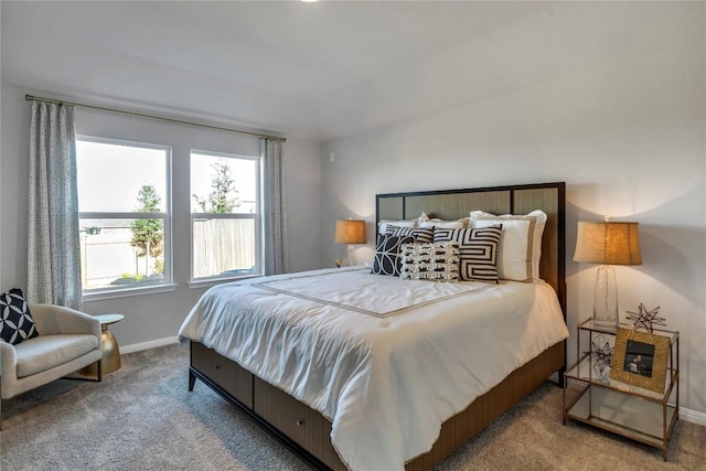 carpeted bedroom with baseboards