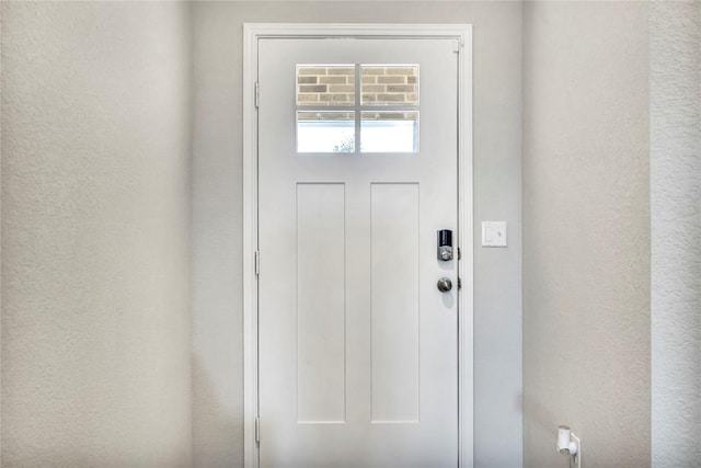 entryway featuring a textured wall