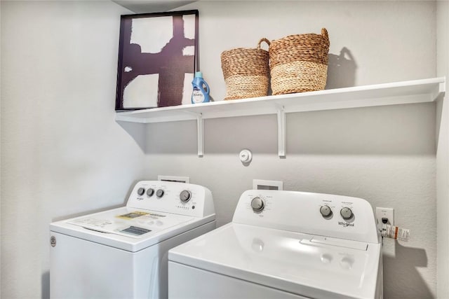 washroom with laundry area and independent washer and dryer