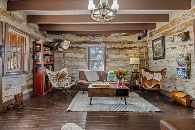 sitting room featuring dark wood-style flooring, wooden ceiling, beamed ceiling, and an inviting chandelier