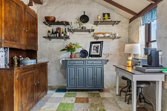 bar featuring vaulted ceiling with beams