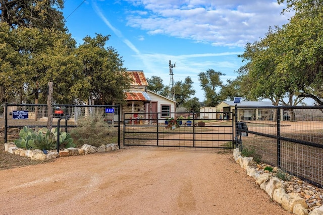 view of gate with fence