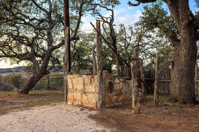 view of gate with fence