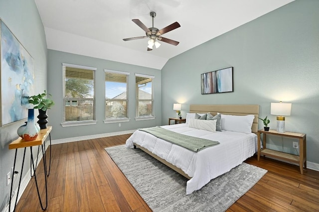 bedroom featuring a ceiling fan, baseboards, vaulted ceiling, and dark wood-type flooring