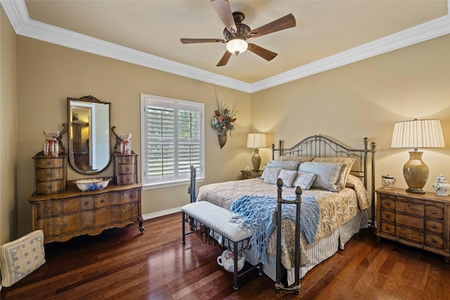 bedroom featuring dark wood-style flooring, crown molding, baseboards, and ceiling fan