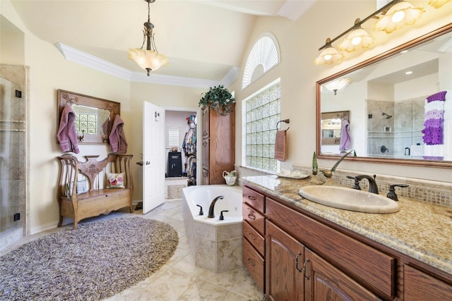 full bath featuring a garden tub, a spacious closet, crown molding, vanity, and a shower stall