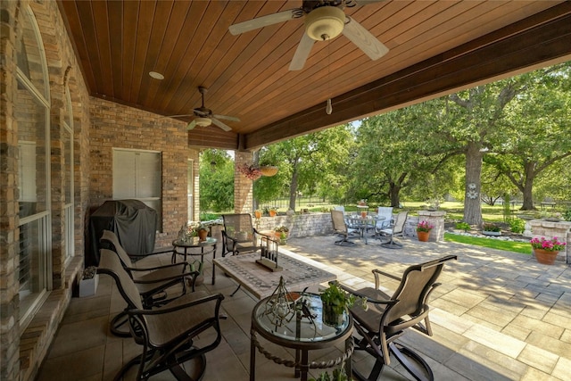 view of patio / terrace with ceiling fan, outdoor dining area, and grilling area