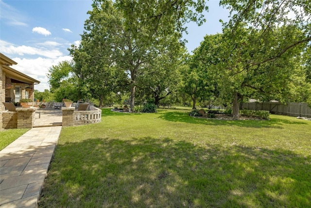 view of yard featuring a patio area and fence