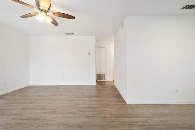 607 Magnolia St, Bastrop, TX 78602 - empty room featuring wood finished floors, ceiling fan, and baseboards