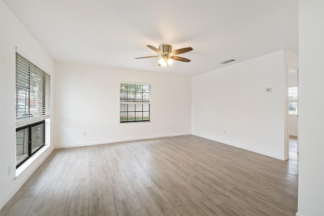 607 Magnolia St, Bastrop, TX 78602 - empty room featuring wood finished floors, a ceiling fan, and baseboards