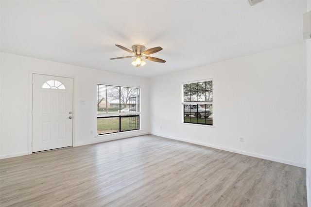 entrance foyer with light wood-style floors, baseboards, and a ceiling fan