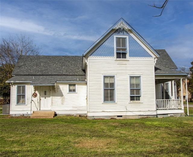 rear view of property with a yard, central AC unit, crawl space, and a shingled roof