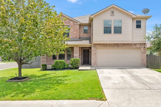 view of front of home with brick siding, concrete driveway, fence, a garage, and a front lawn