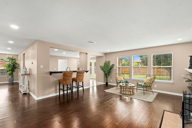 interior space with recessed lighting, visible vents, dark wood finished floors, and baseboards