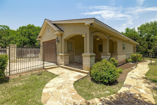 view of front of property featuring a garage, fence, driveway, and stucco siding