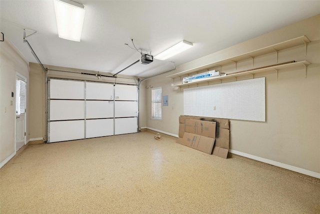 garage featuring baseboards and a garage door opener