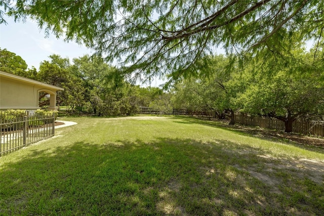 view of yard with a fenced backyard