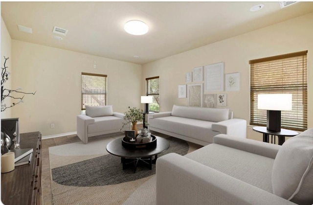 living room featuring light tile patterned floors, visible vents, and baseboards